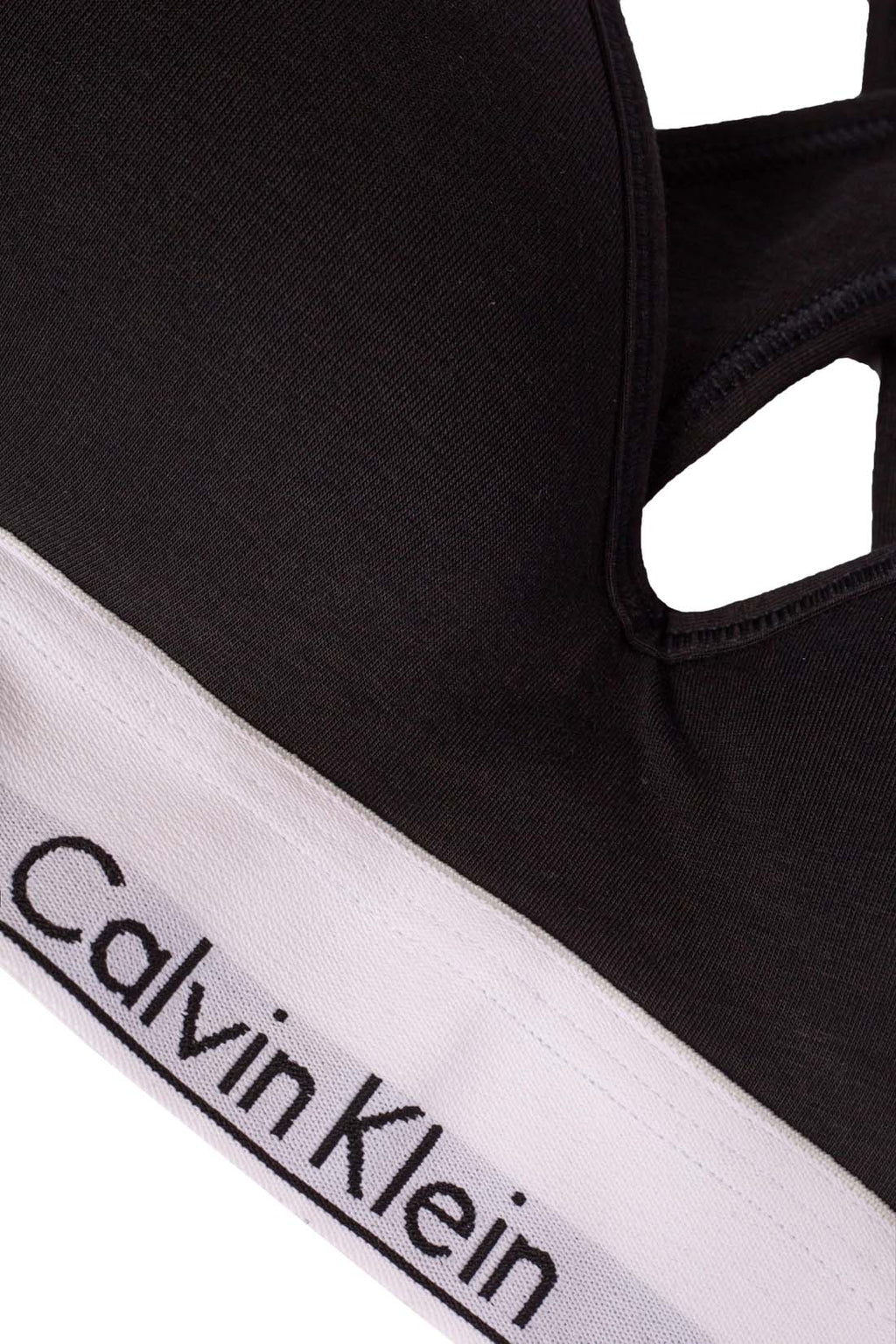 White women's v-neck bralette with crossover straps and contrasting elastic logo band — view 3