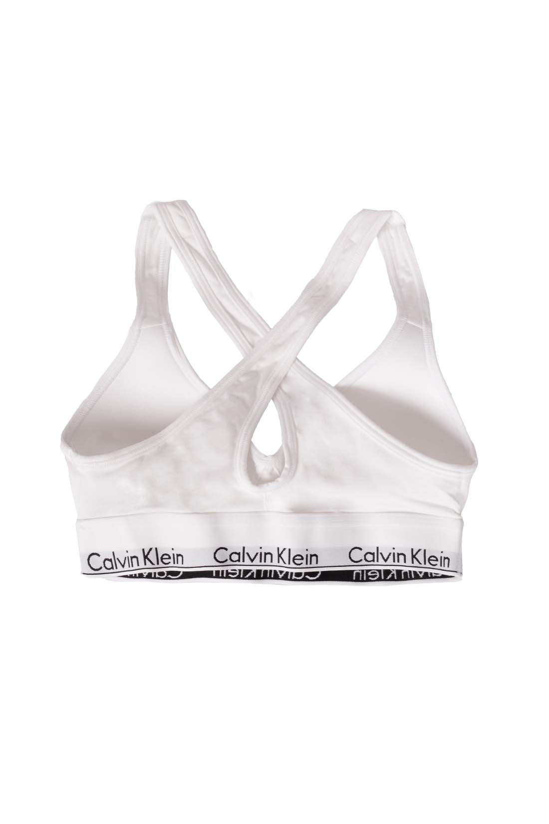 White women's v-neck bralette with crossover straps and contrasting elastic logo band — view 7