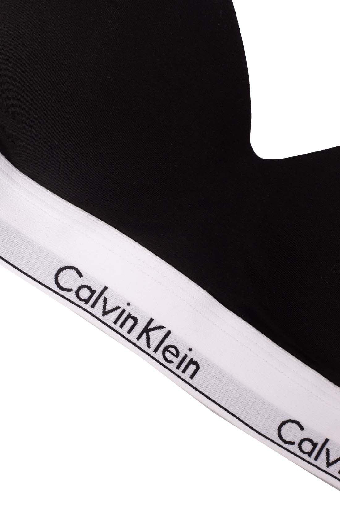 Women's black cotton modal bra with adjustable straps, padded cups, and elasticated logo underbust band