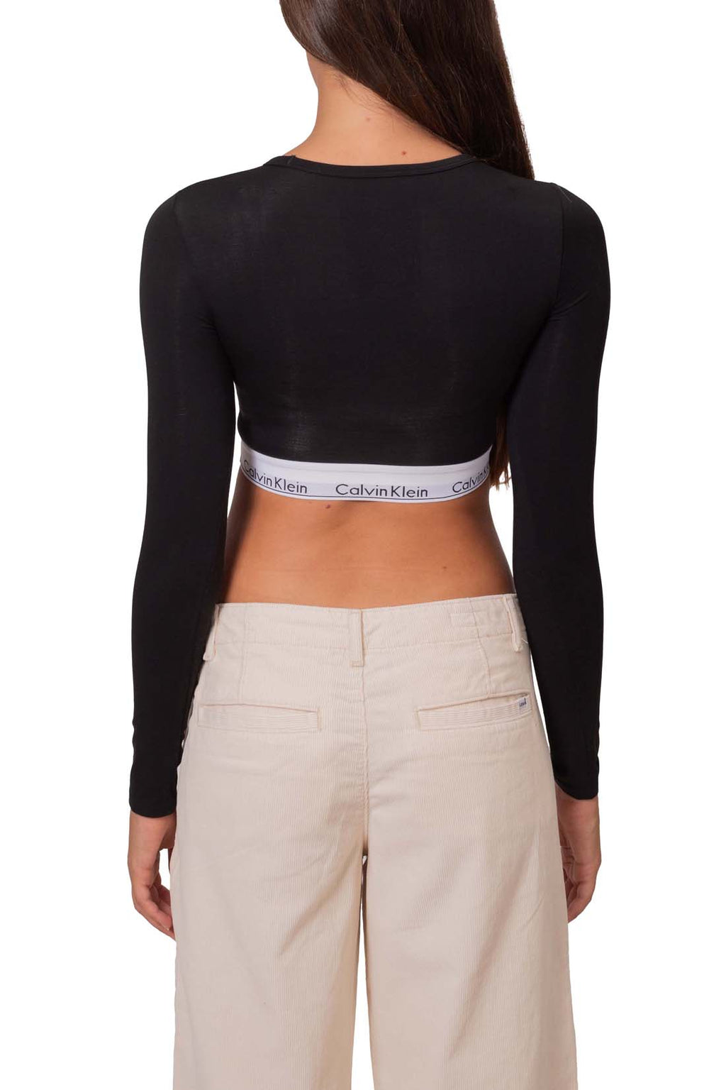 Black long sleeve women's slim top with built-in cups and branded elastic underbust band — view 3