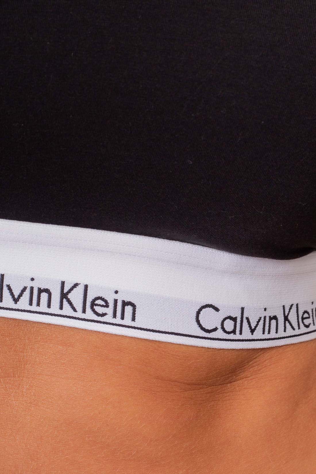 Black long sleeve women's slim top with built-in cups and branded elastic underbust band — view 5