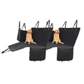 Black waterproof dog car seat cover hammock installed in vehicle back seat with secure straps