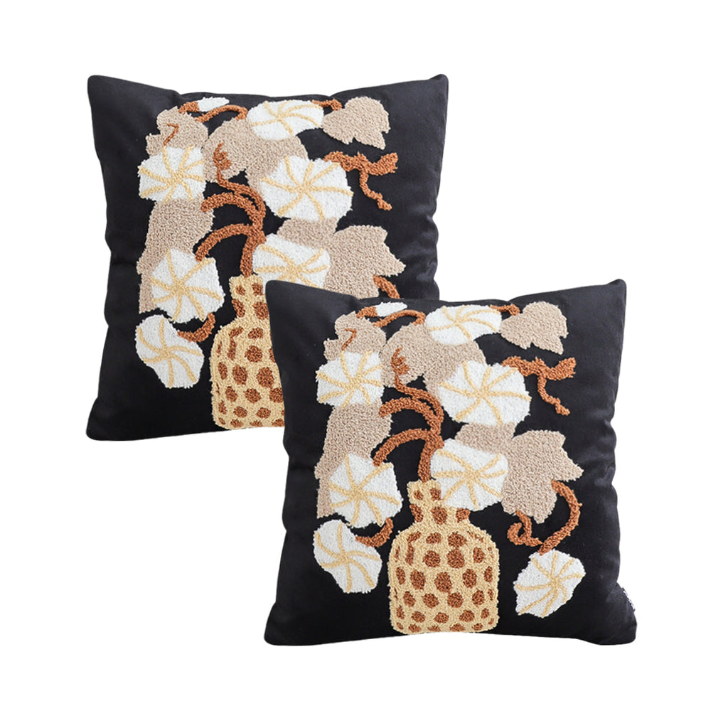 Floral embroidered throw pillow set in black and gold square design with wicker basket motif