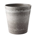 Rock grey round resin plant pot with a concrete cement pattern for indoor gardening