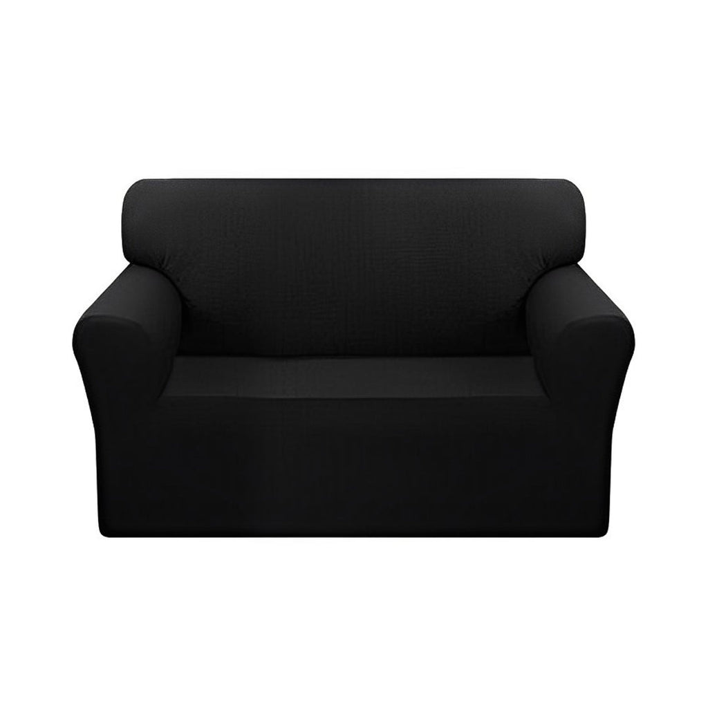 Black 2-seater high stretch sofa cover protecting a living room couch from spills and stains