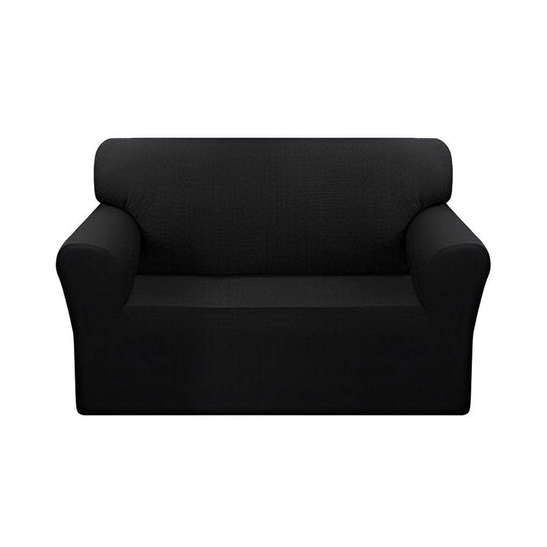 Black 2-seater high stretch sofa cover protecting a living room couch from spills and stains