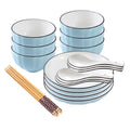 Blue Japanese ceramic dinnerware set with stackable soup bowls, plates, spoons, and chopsticks on table
