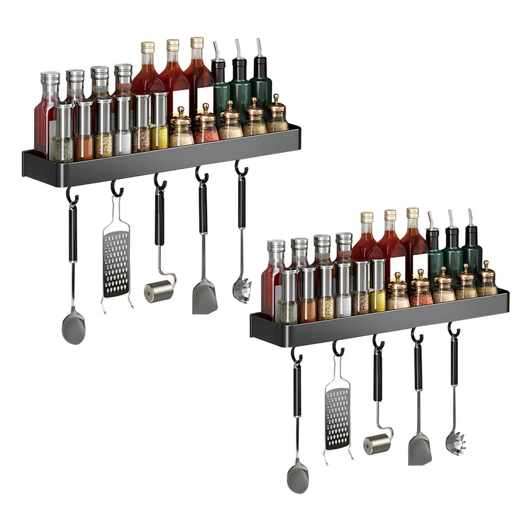 Two black aluminum wall mounted kitchen spice storage racks with hanging hooks for organizing utensils.