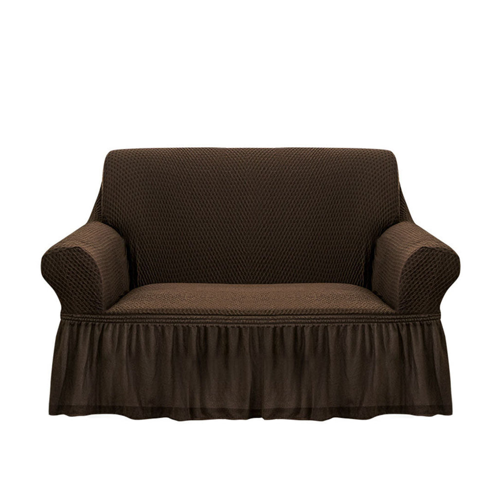 Coffee brown two-seater high stretch sofa cover with ruffled skirt protecting a living room couch