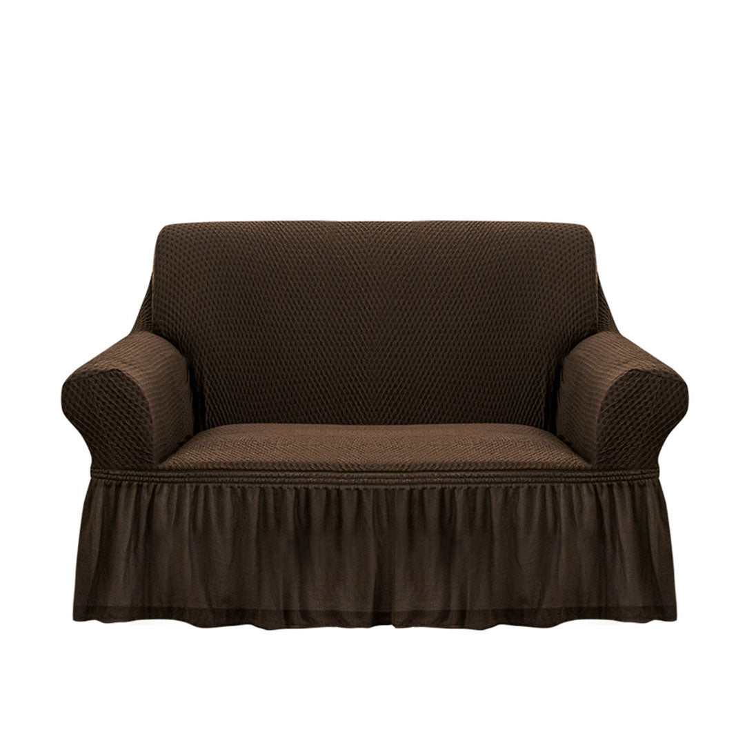 Coffee brown two-seater high stretch sofa cover with ruffled skirt protecting a living room couch