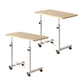 Set of two movable white maple wood bedside tables with sturdy metal frames and rolling wheels
