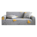 Grey geometric print 4-seater sofa cover stretched securely over a modern living room couch