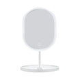 White oval LED makeup vanity mirror on a stand with bright illuminated tricolor adjustable lighting