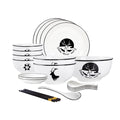 White antler ceramic dinnerware set with bowls, plates, spoons, and chopsticks on a dining table