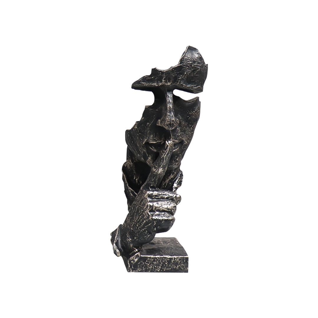 Black abstract resin shush face sculpture with an antique bronze finish and fractured texture.