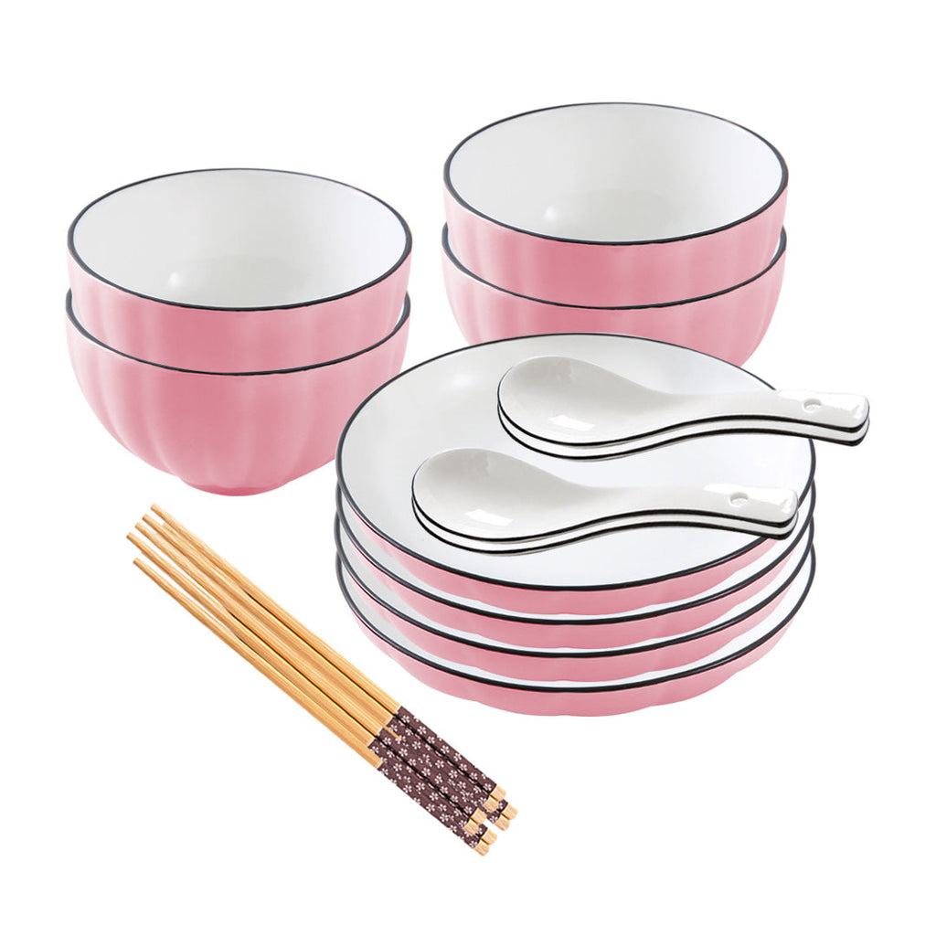 Pink Japanese ceramic dinnerware set featuring stackable plates, soup bowls, matching spoons, and chopsticks