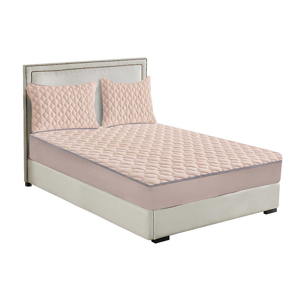 Beige quilted fleece mattress cover protector with clover design and two matching pillowcases