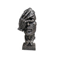 Abstract face sculpture in antique bronze black resin with a hand-over-eyes modern design.