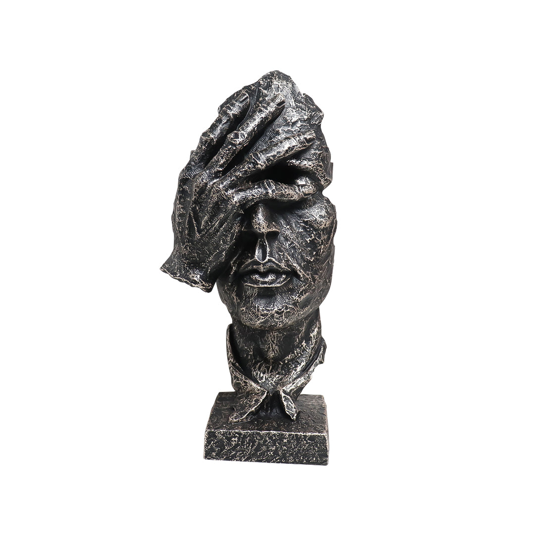 Abstract face sculpture in antique bronze black resin with a hand-over-eyes modern design.