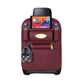 Red PVC leather multi-pocket car backseat organizer with tablet holder strapped to vehicle seat