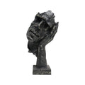 Black resin face sculpture of a thoughtful tilted head resting on a hand, antique bronze finish