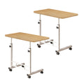 Two movable walnut wood bedside tables with white metal frames and rolling wheels.