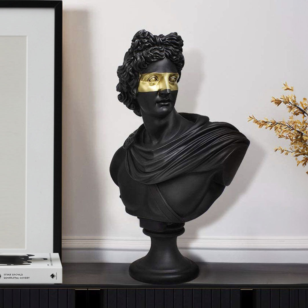 Black resin classical bust sculpture featuring a modern gold eye mask on a marble base. — view 2