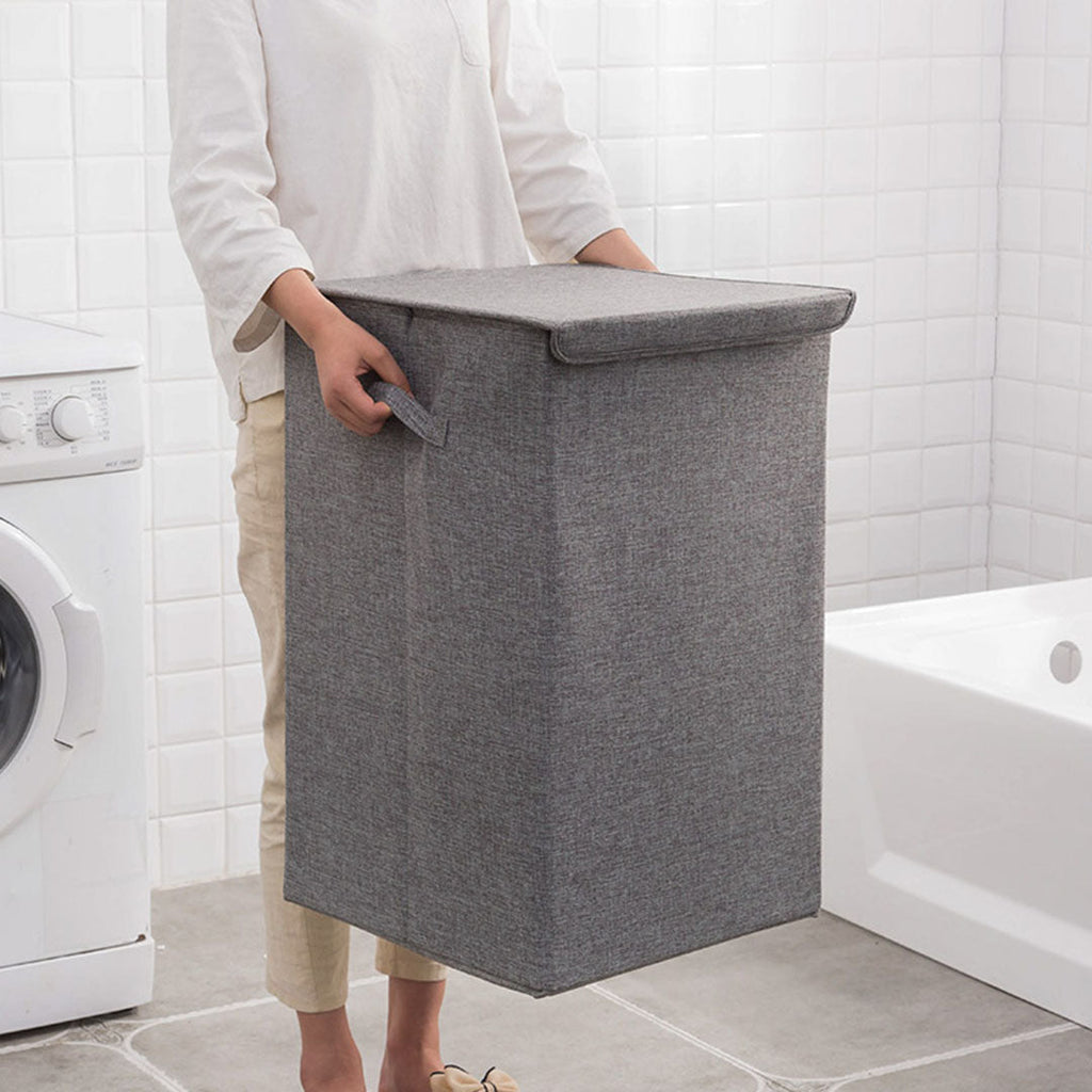 Two grey collapsible canvas laundry hampers with lids and carrying handles for home storage — view 2