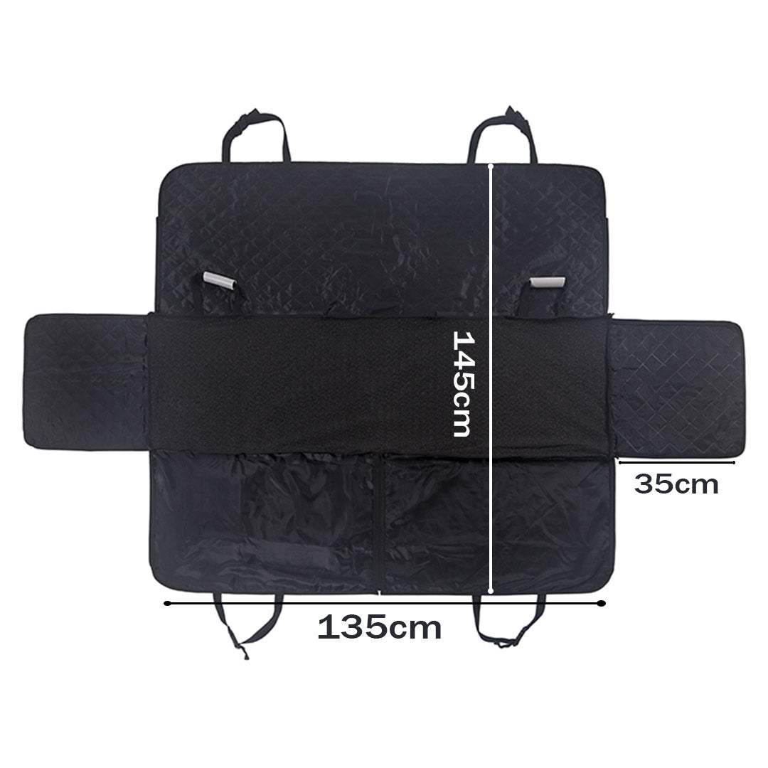Black waterproof dog car seat cover hammock installed in vehicle back seat with secure straps — view 2