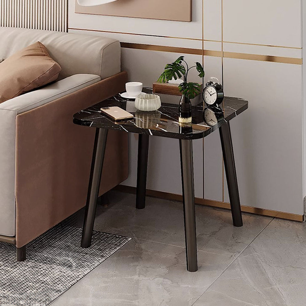 Black stone-patterned side table with sleek pine wood legs in a modern minimalist living room. — view 2
