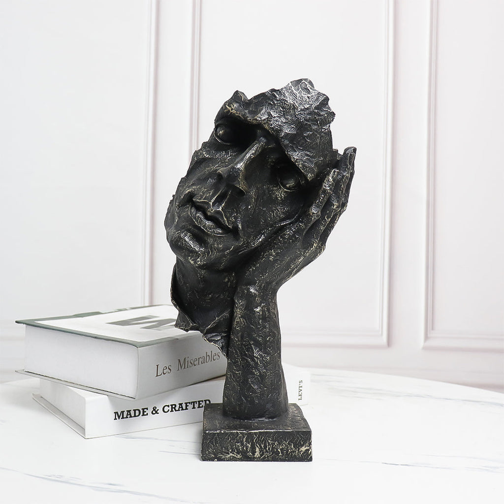 Black resin face sculpture of a thoughtful tilted head resting on a hand, antique bronze finish — view 2
