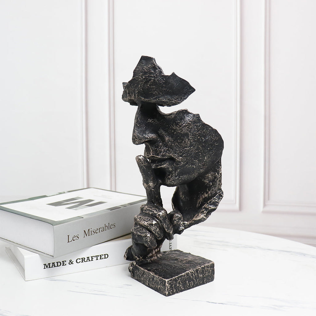 Black abstract resin shush face sculpture with an antique bronze finish and fractured texture. — view 2