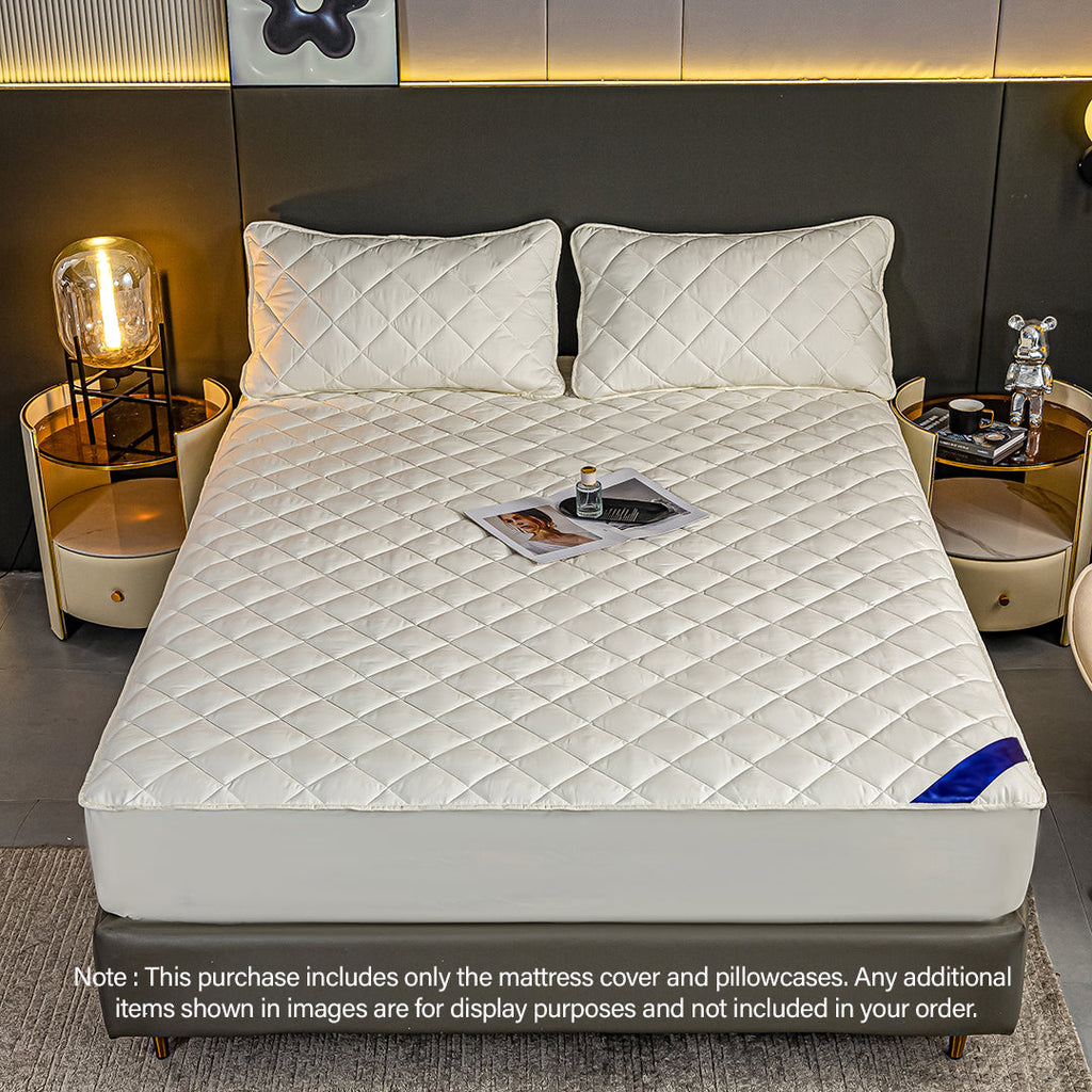White quilted mattress cover and two pillowcases on a bed, premium polyester stretchable bed protector — view 2