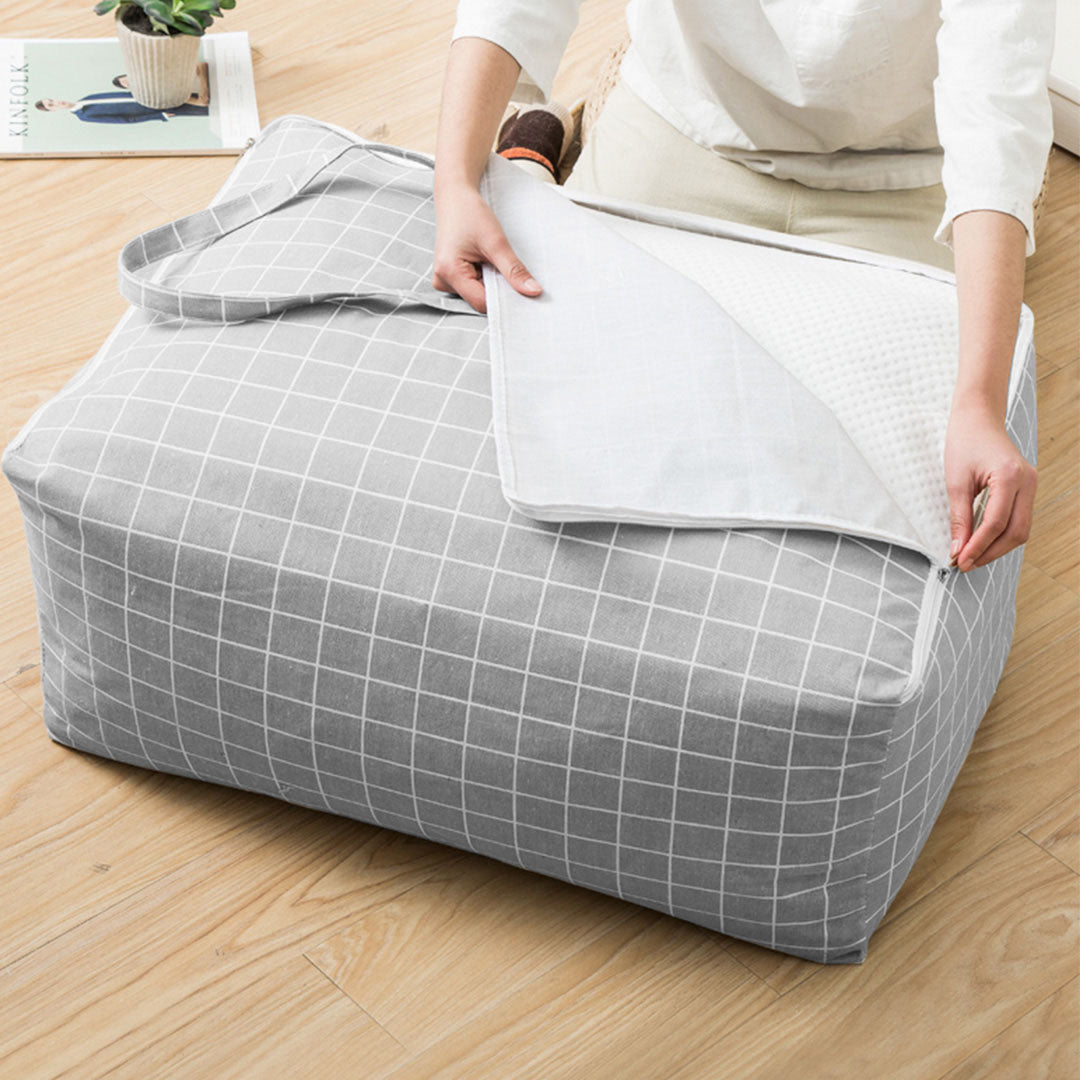 Two medium grey plaid foldable storage luggage bags with double zippers and cross-stitched handles — view 2