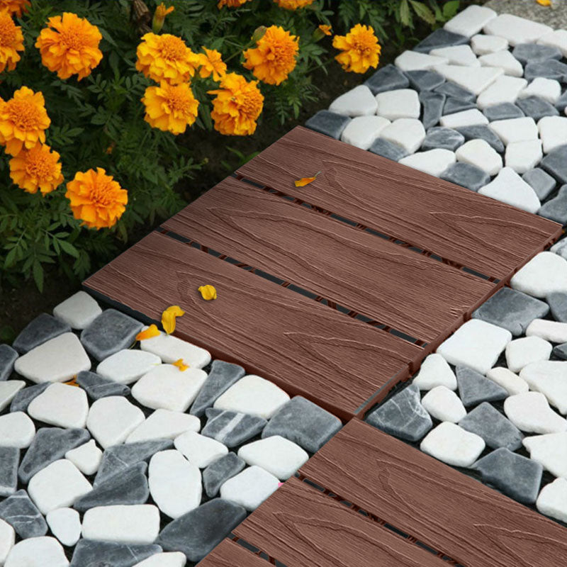 Dark chocolate wood composite interlocking decking tiles arranged for outdoor garden or patio flooring — view 3