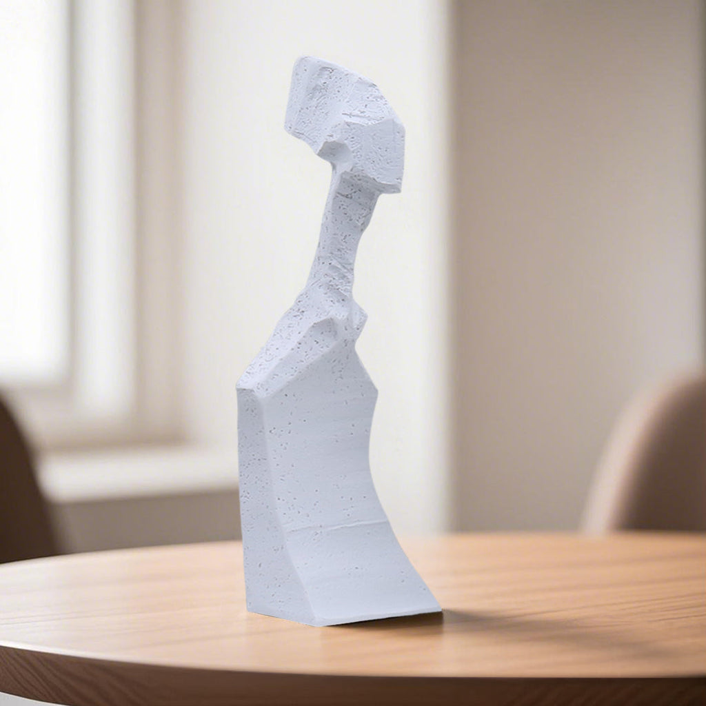 White resin abstract sculpture with modern angular design on display in a minimalist home decor setting — view 3