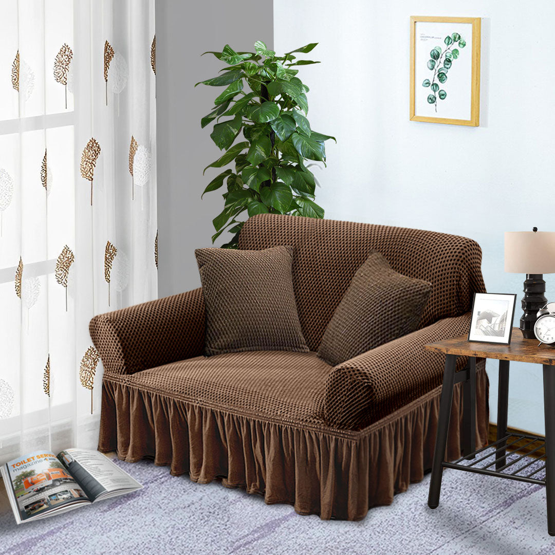 Coffee brown two-seater high stretch sofa cover with ruffled skirt protecting a living room couch — view 3
