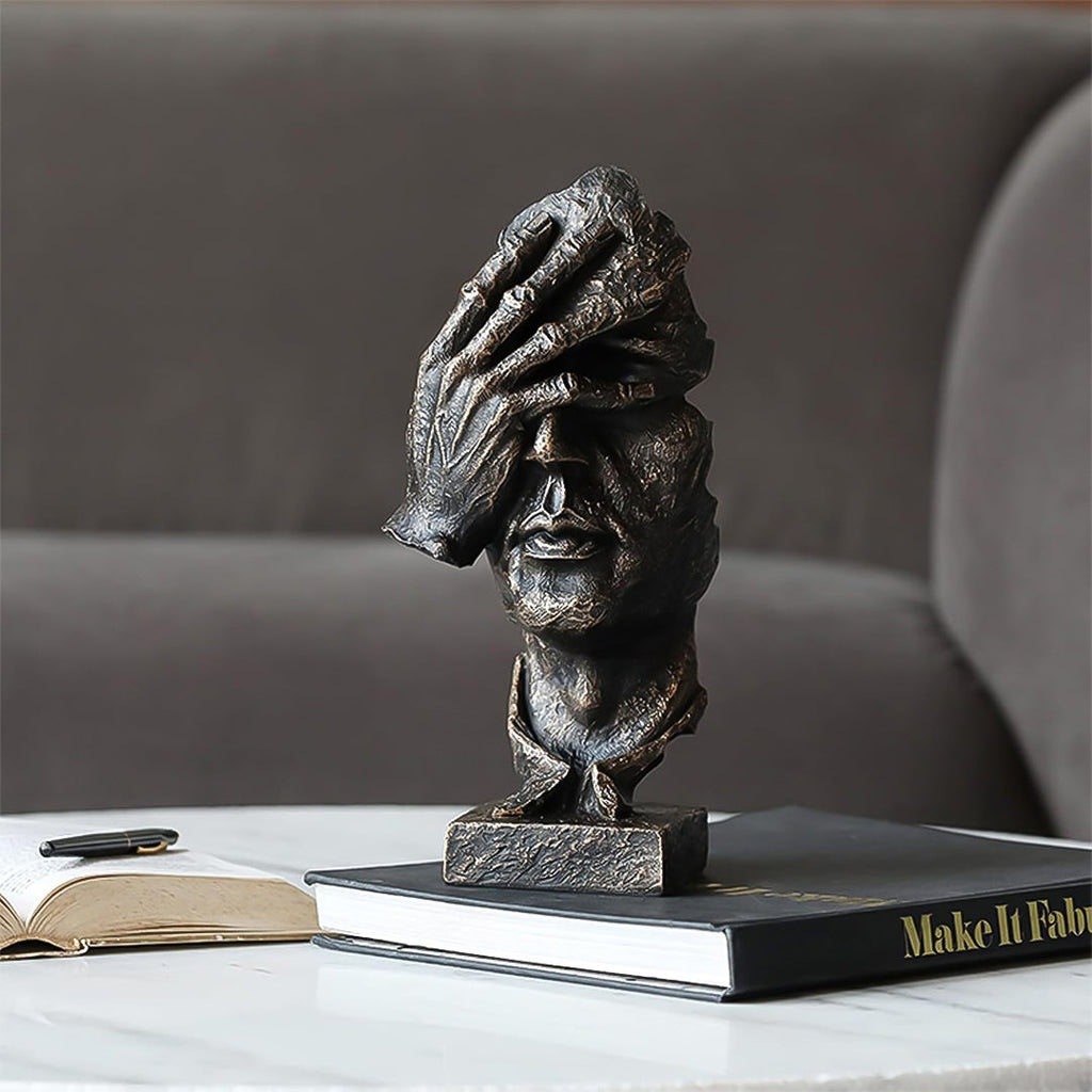 Abstract face sculpture in antique bronze black resin with a hand-over-eyes modern design. — view 3
