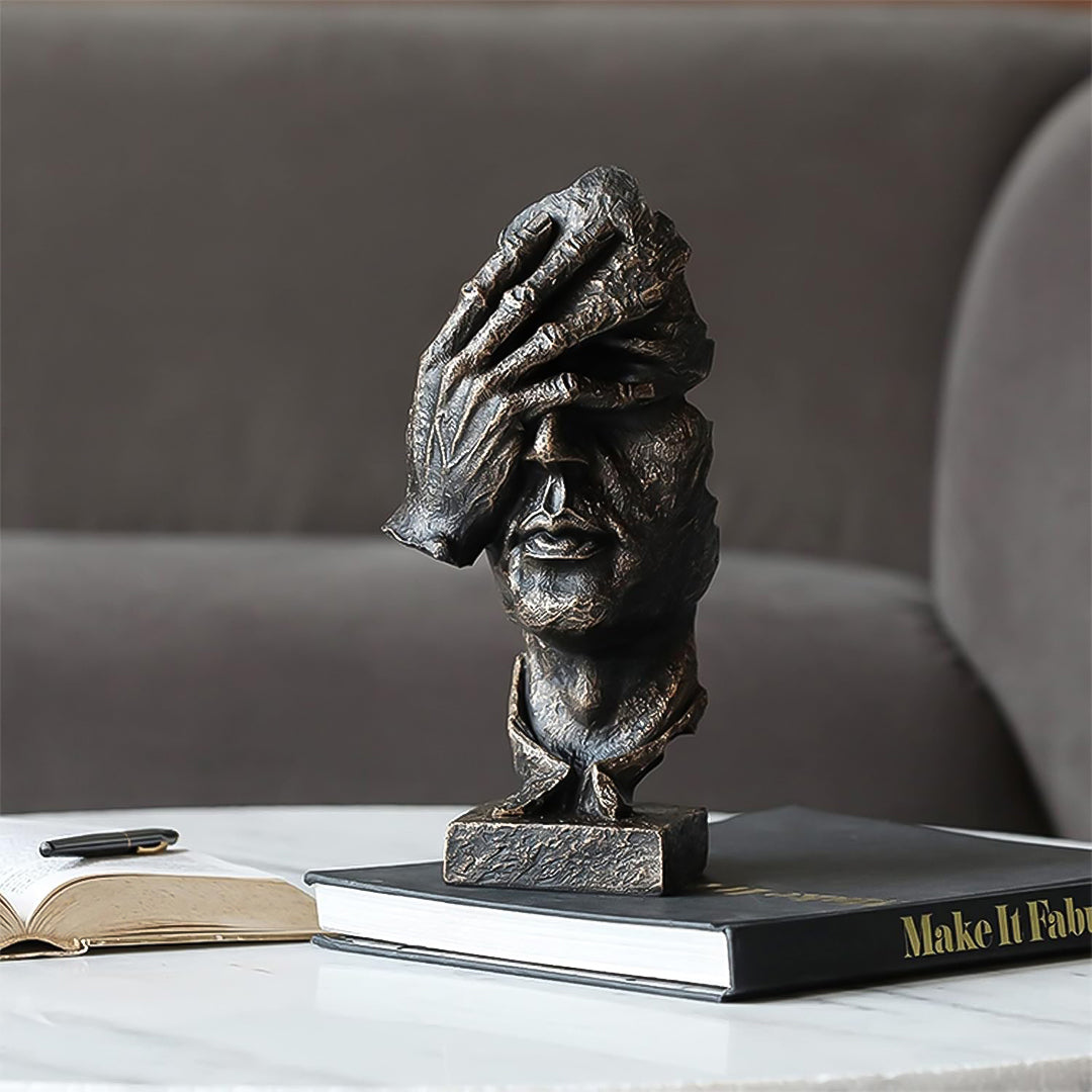 Abstract face sculpture in antique bronze black resin with a hand-over-eyes modern design. — view 3