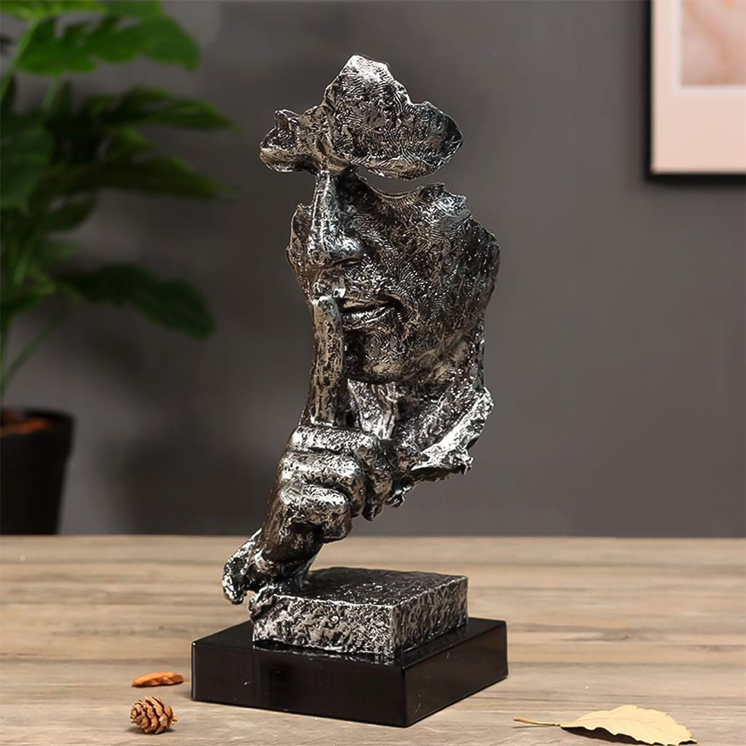 Black abstract resin shush face sculpture with an antique bronze finish and fractured texture. — view 3