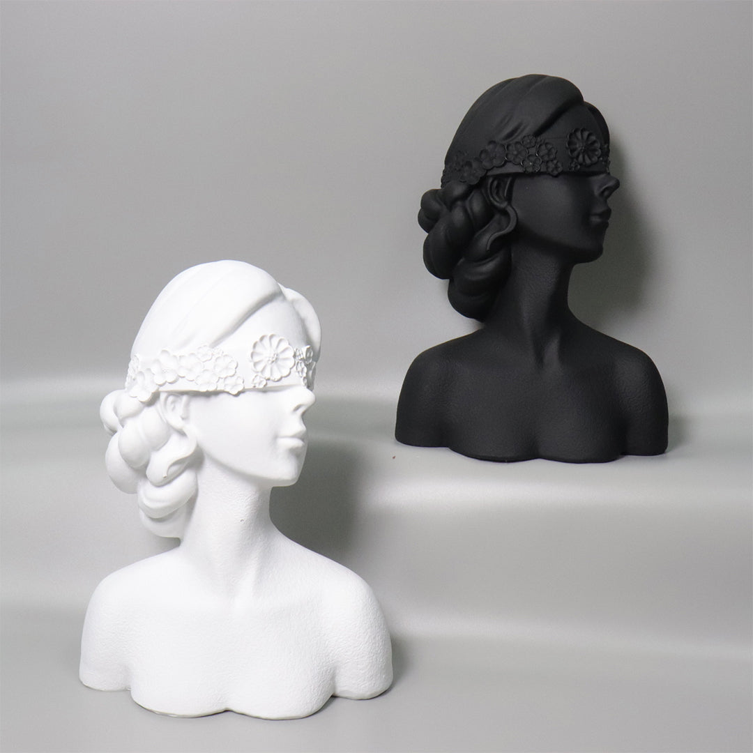 Matte black resin bust sculpture of a blindfolded lady with delicate floral crown detailing. — view 3