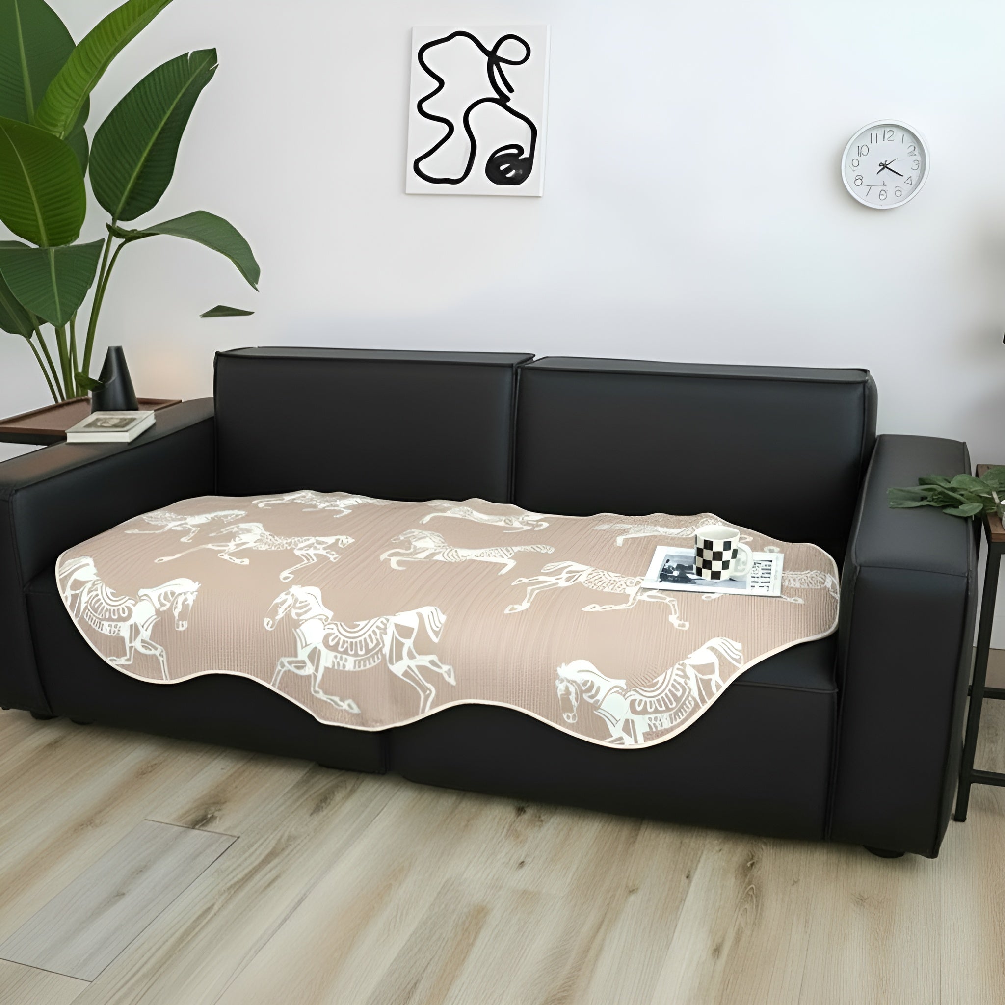Beige two-seater sofa cover with black horse print draped elegantly over a couch — view 3