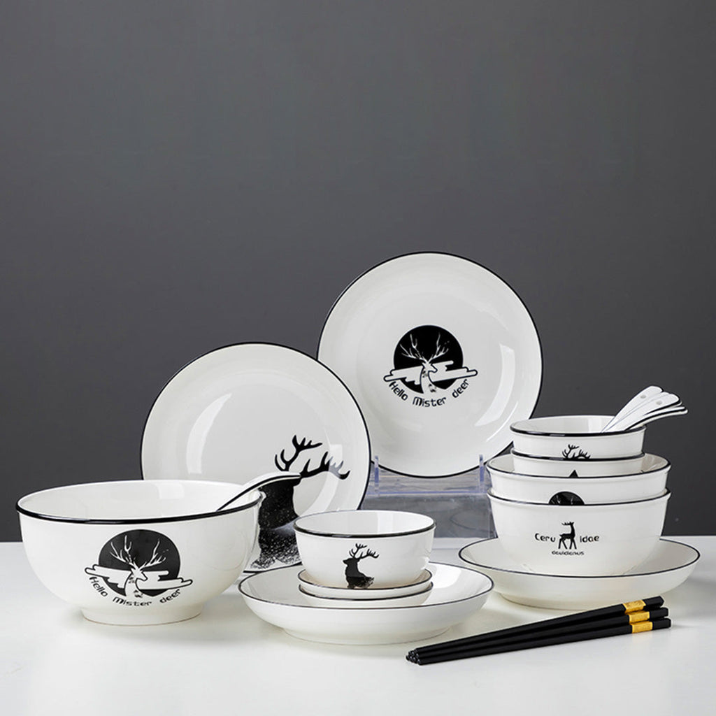 White antler ceramic dinnerware set with bowls, plates, spoons, and chopsticks on a dining table — view 3