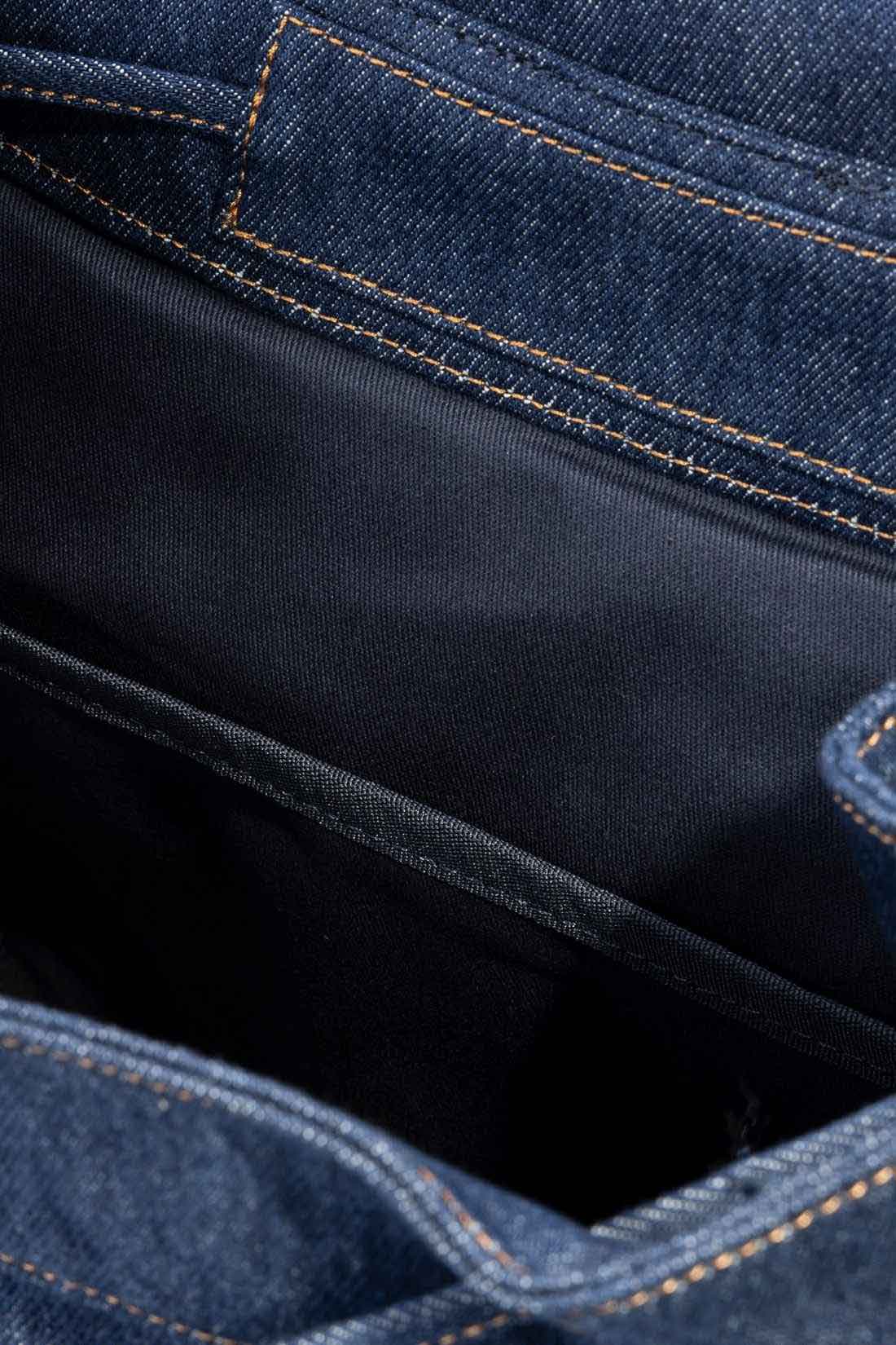 Men's Levi's denim heritage backpack with brown leather details and adjustable shoulder straps — view 9