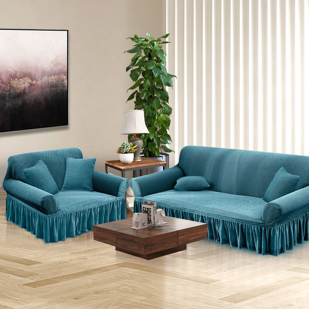 Blue high-stretch 2-seater sofa cover with elegant ruffled skirt protecting a living room couch — view 4