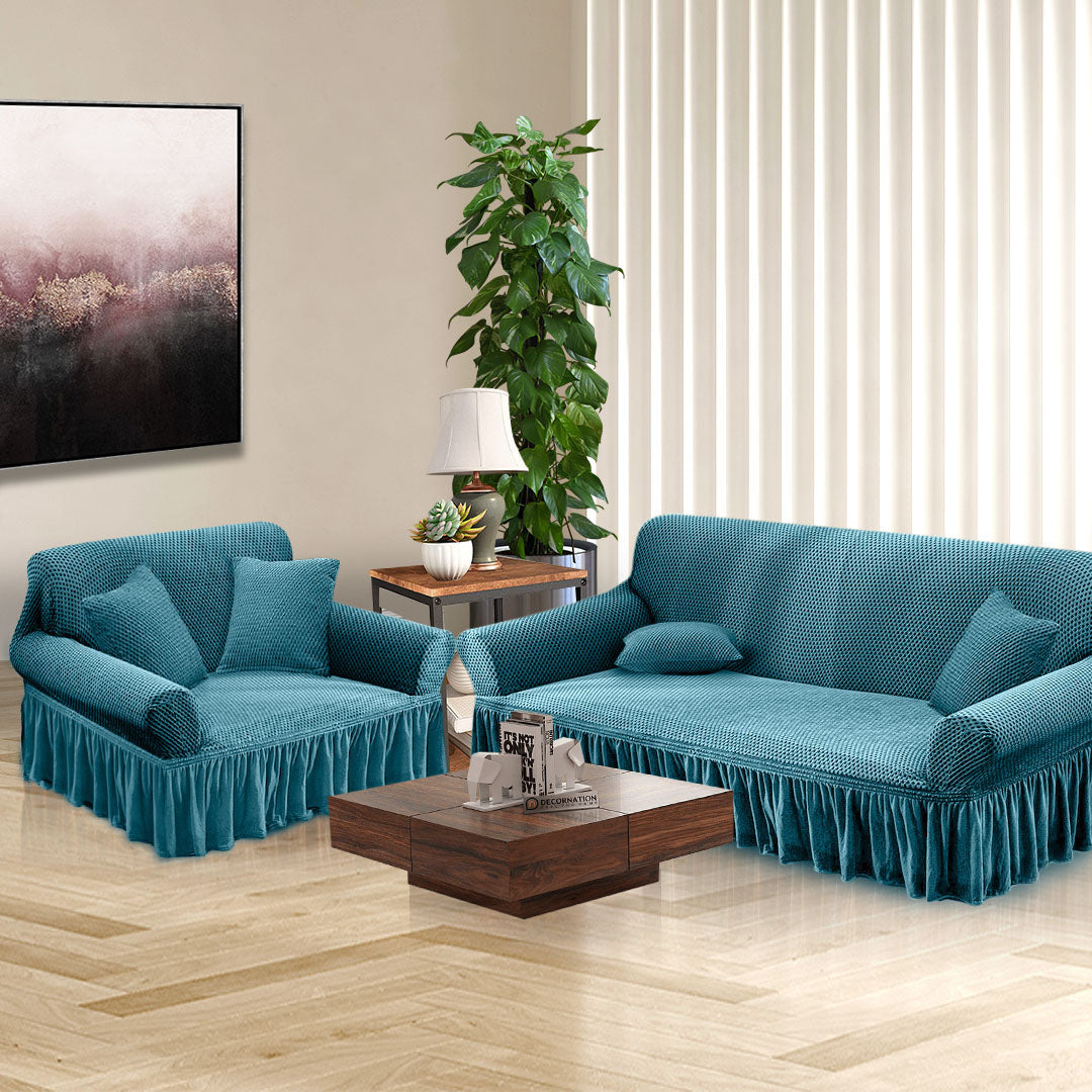 Blue high-stretch 2-seater sofa cover with elegant ruffled skirt protecting a living room couch — view 4