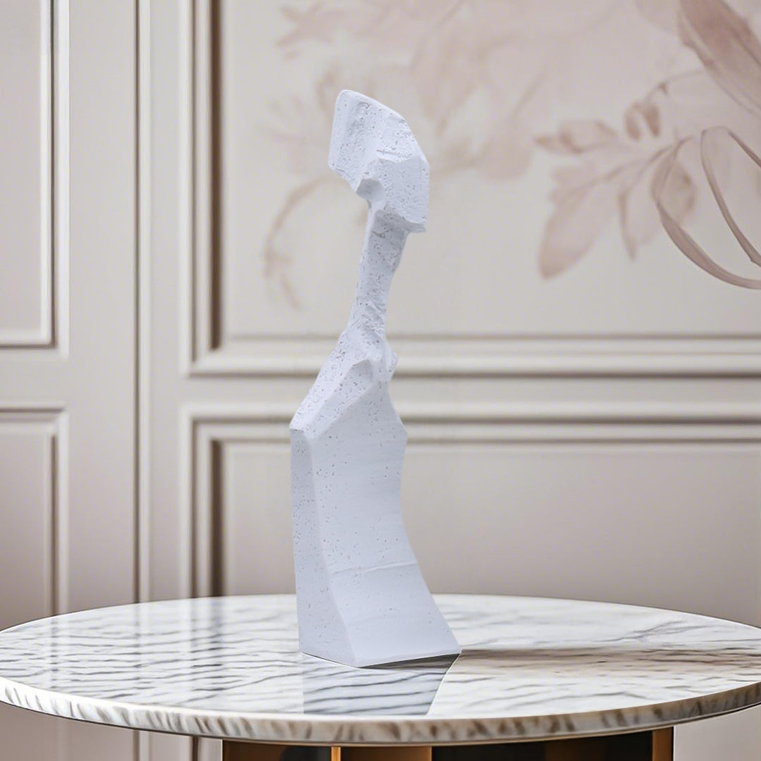 White resin abstract sculpture with modern angular design on display in a minimalist home decor setting — view 4