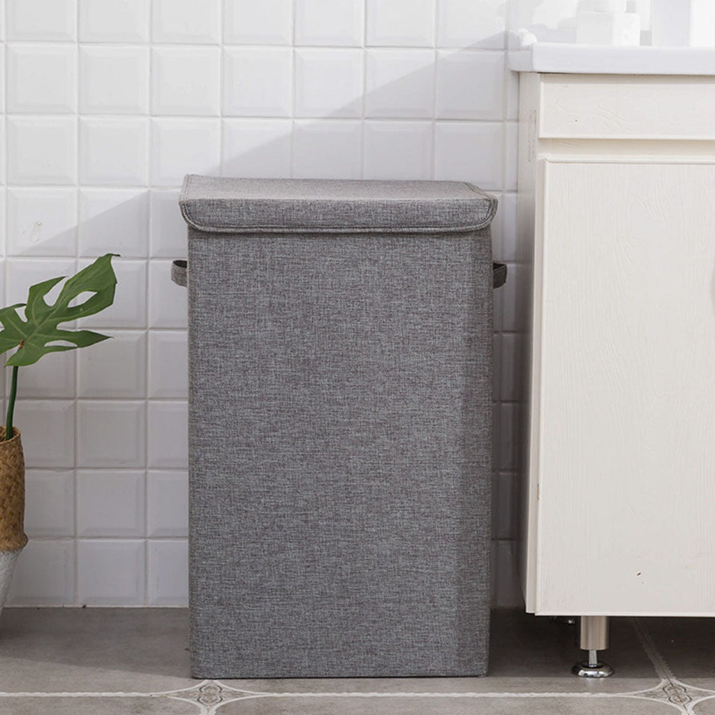 Two grey collapsible canvas laundry hampers with lids and carrying handles for home storage — view 4