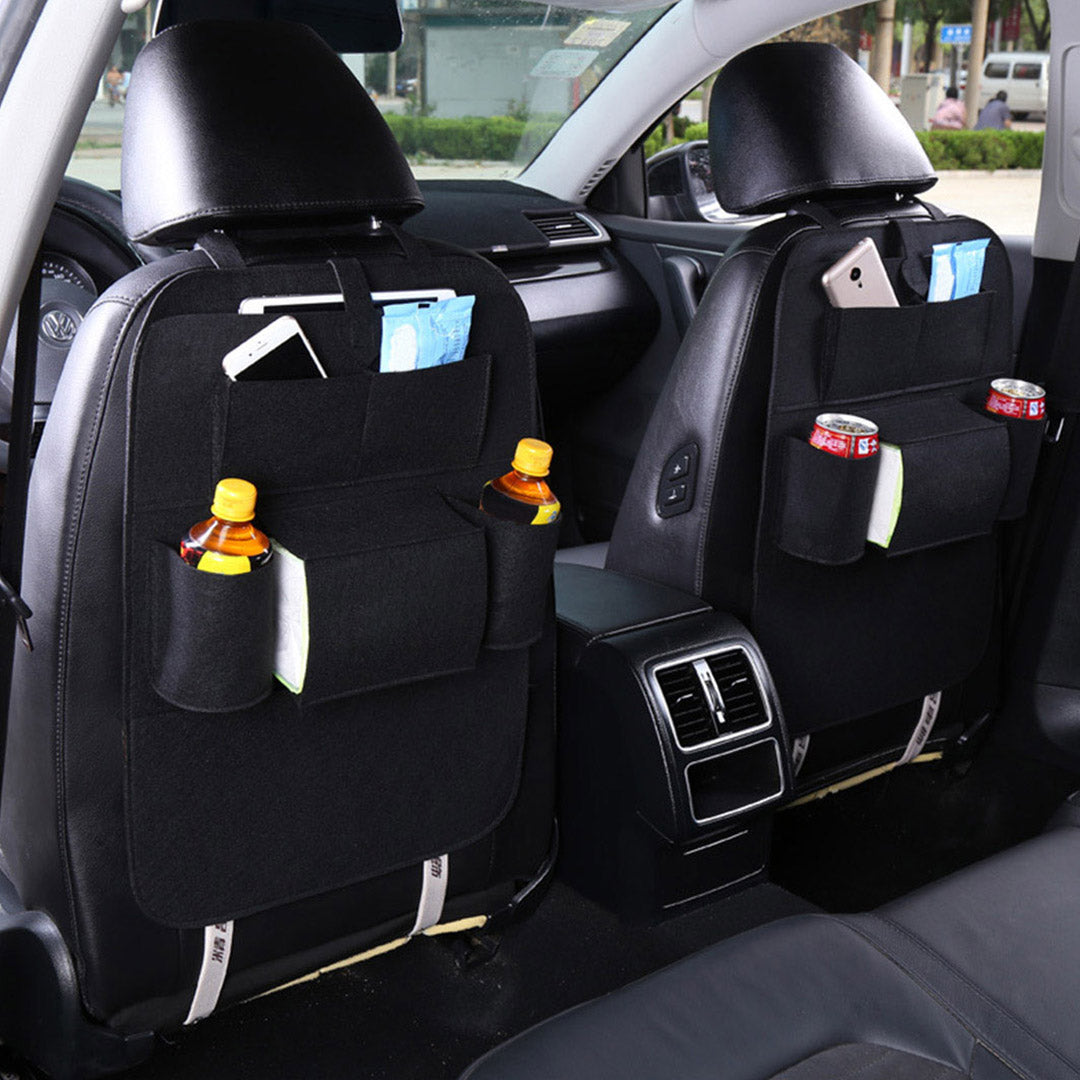 Black PVC leather car backseat organizer with seven multi-purpose storage pockets and adjustable straps. — view 4