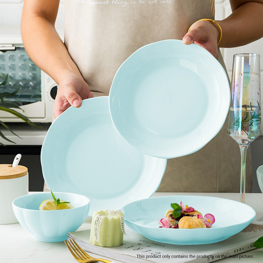 Light blue Japanese style ceramic dinnerware set with bowls plates and chopsticks on a table — view 4
